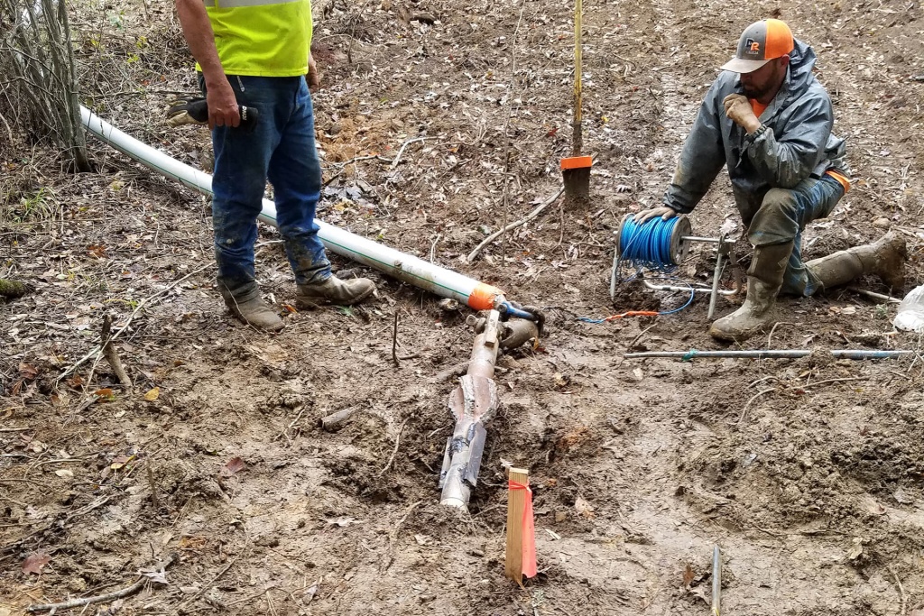 Directional bored creek crossing - pipe about to be pulled in! Thank you to our excellent directional boring subcontractor, Larry Rodgers and HDD, Inc.!